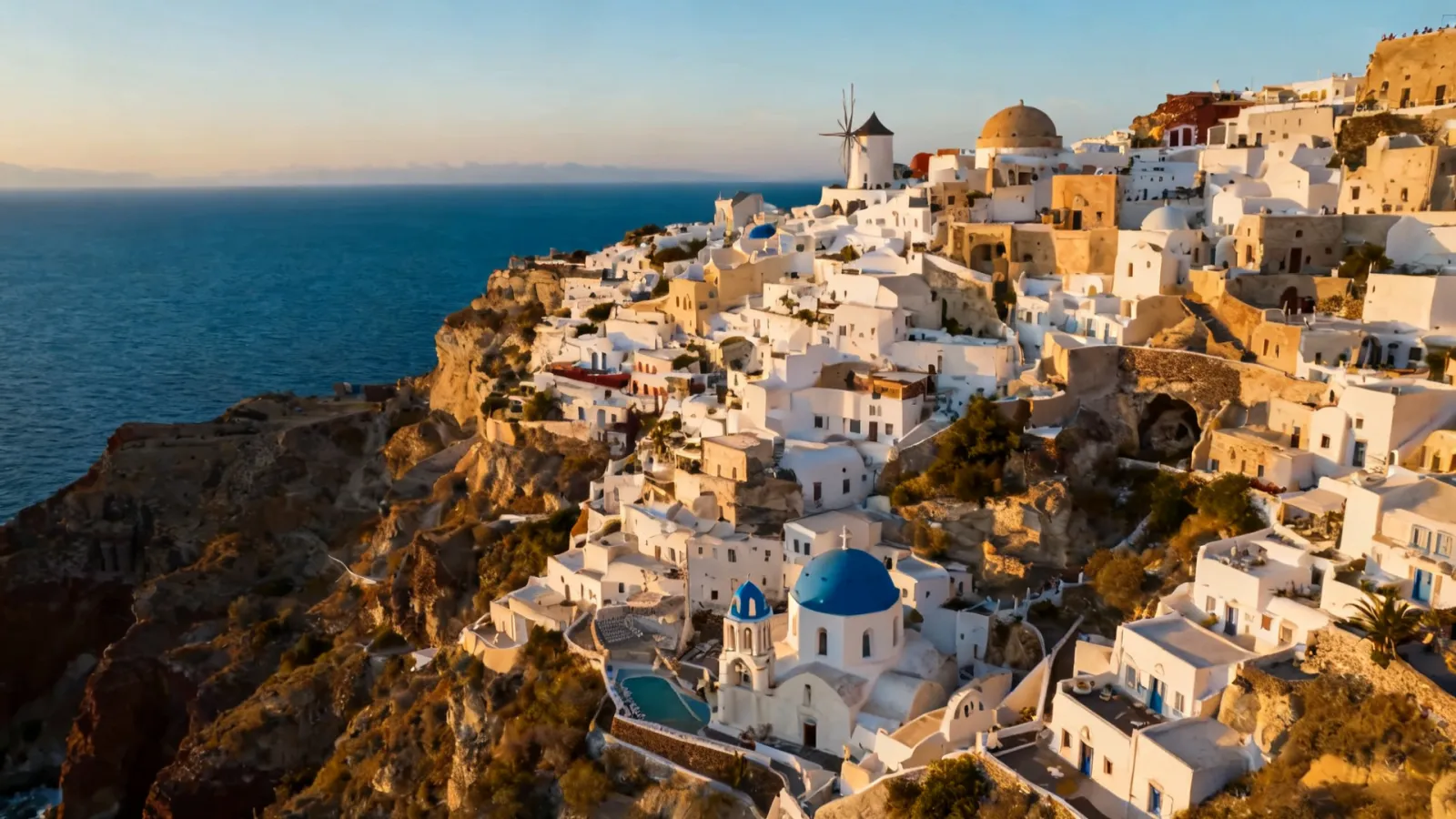 Drone over a white cliffside village